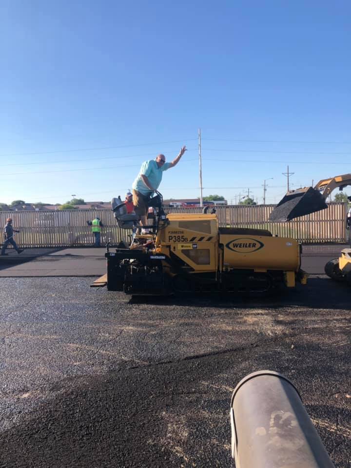 Oil City Paving crew getting equipment ready to lay asphalt.